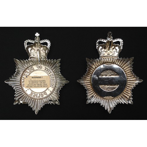 220 - ERII Ministry of Defence Police Helmets plates x 2. Two different makers versions. (2)