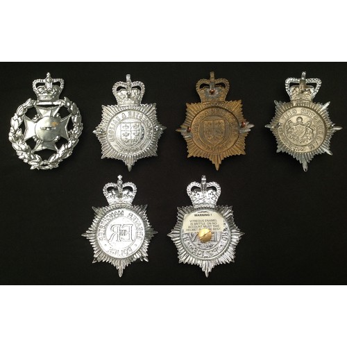 224 - A collection of Manchester and Salford Police helmet plates: Wreathed Salford Police, ERII Mancheste... 