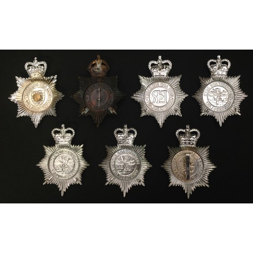 234 - A collection of Somersetshire Police helmet plates to include: Kings Crown Somersetshire Constabular... 