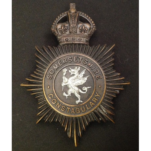 234 - A collection of Somersetshire Police helmet plates to include: Kings Crown Somersetshire Constabular... 