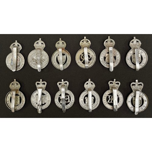 307 - A collection of Kings Crown & Queens Crown Police Cap badges to include: Metropolitan Police: Dorset... 