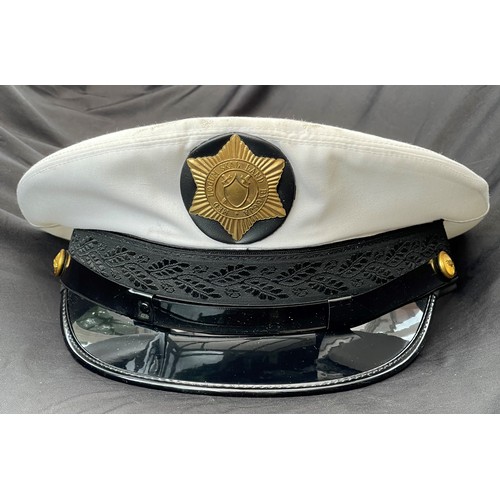 315 - Icelandic Police Officers caps x2. White top peaked summer cap. Complete with cap badge and chinstra... 