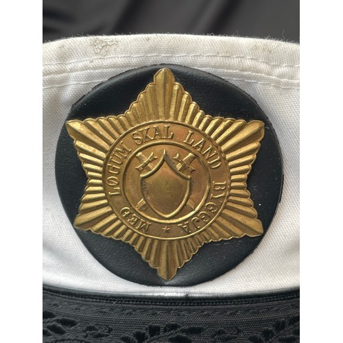 315 - Icelandic Police Officers caps x2. White top peaked summer cap. Complete with cap badge and chinstra... 