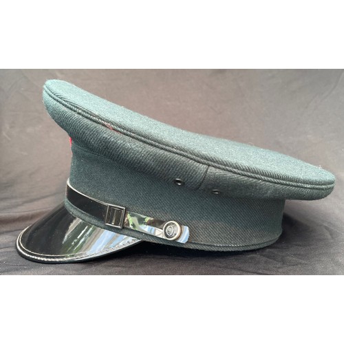 328 - Royal Ulster Constabulary Officers Peaked Caps x 2. Both complete with Queens Crown cap badge and ch... 