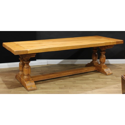 15 - A large oak refectory trestle dining table, Monastere Chambord, rectangular top, turned pillars, rec... 