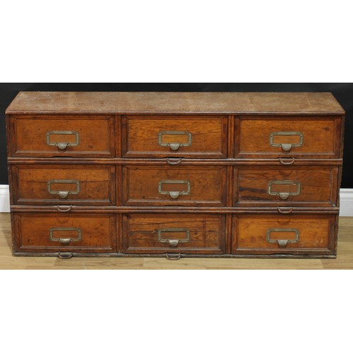 104 - An early 20th century oak 'notary' filing cabinet, by Stolzenberg, rectangular top above nine doors,... 