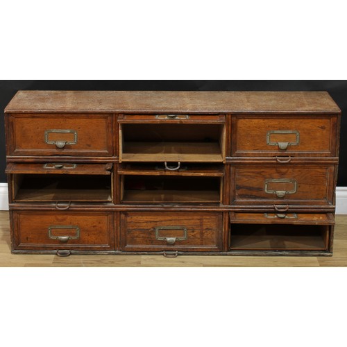 104 - An early 20th century oak 'notary' filing cabinet, by Stolzenberg, rectangular top above nine doors,... 