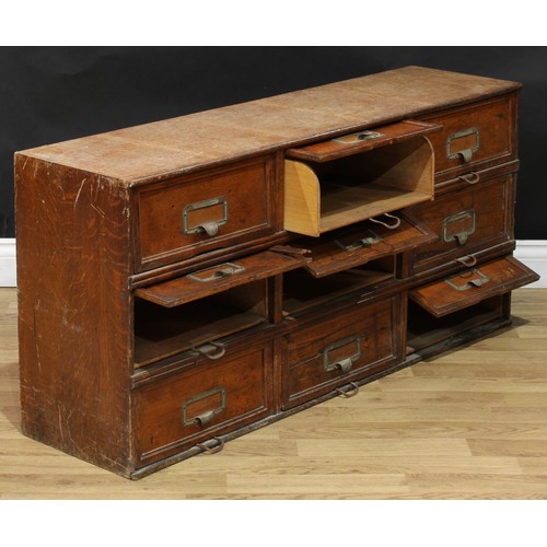 104 - An early 20th century oak 'notary' filing cabinet, by Stolzenberg, rectangular top above nine doors,... 