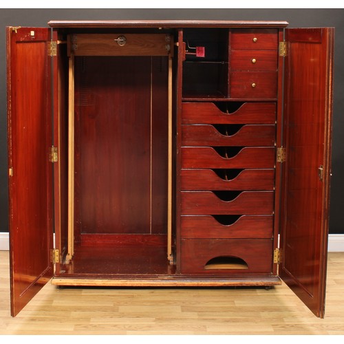 107 - An early 20th century mahogany compactum wardrobe, by Innovation, 16 New Bond Street, London, Paris,... 