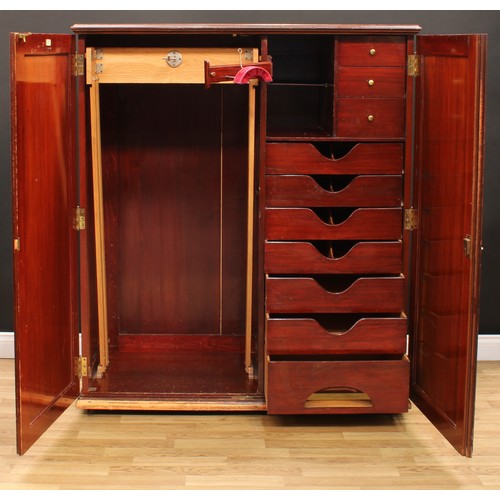 107 - An early 20th century mahogany compactum wardrobe, by Innovation, 16 New Bond Street, London, Paris,... 