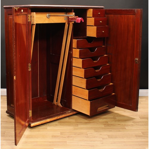 107 - An early 20th century mahogany compactum wardrobe, by Innovation, 16 New Bond Street, London, Paris,... 