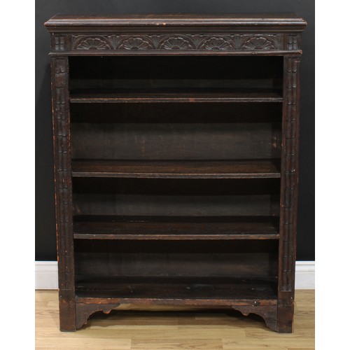 111 - A late Victorian ebonised oak open bookcase, carved with scrolling acanthus and floral lunettes, 114... 