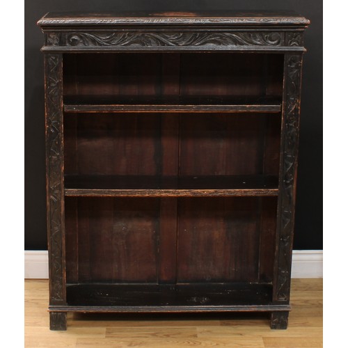 111 - A late Victorian ebonised oak open bookcase, carved with scrolling acanthus and floral lunettes, 114... 