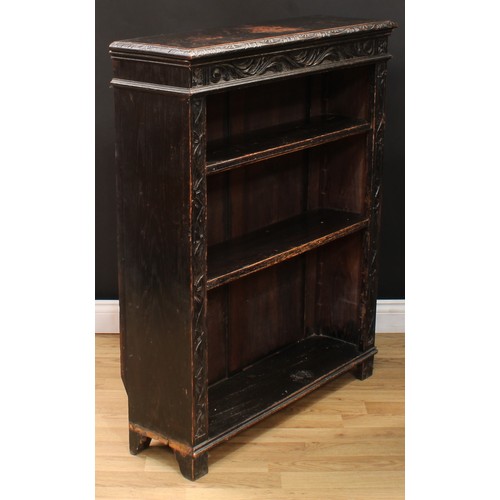 111 - A late Victorian ebonised oak open bookcase, carved with scrolling acanthus and floral lunettes, 114... 