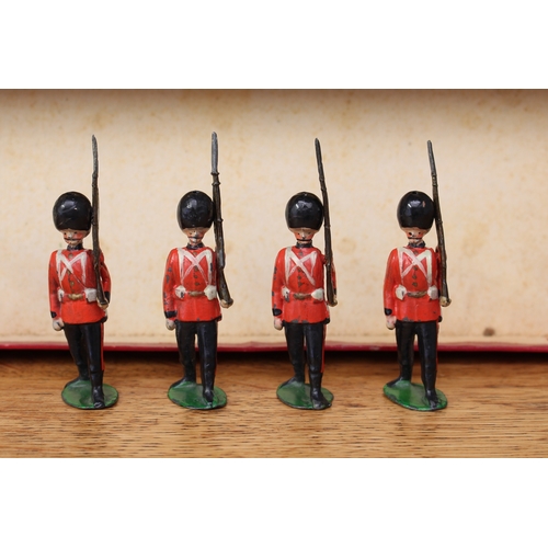 2285 - W Britain (Britains) No.107 British Soldiers The Irish Guards, comprising marching officer and seven... 