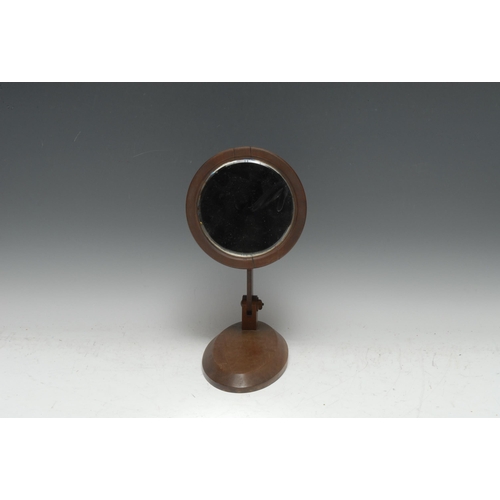 3331 - An early 20th century mahogany campaign type travelling shaving mirror, adjustable for table-top and... 