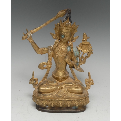 3390 - Chinese School, a gilt bronze, Manjushri Tara, seated in meditation with sword, lotus base, sealed, ... 