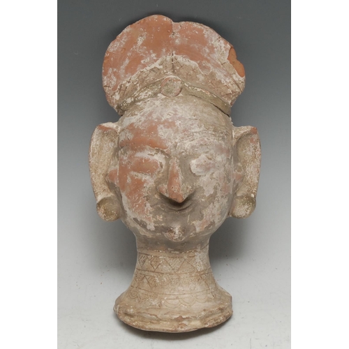 3373 - Antiquities - an Indian terracotta sculptural fragment, as a female head, traces of geometric decora... 