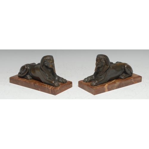 3405 - French School (19th century), a pair of Egyptian Revival bronzes,each cast as a sphinx, rectangular ... 