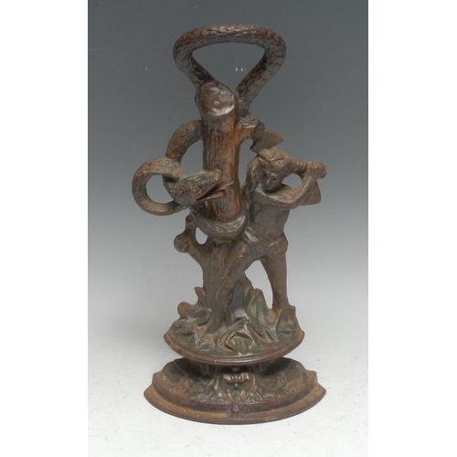 3021 - A 19th century cast iron door stop, allegorical as a woodsman striking a serpent and tree, 34.5cm hi... 