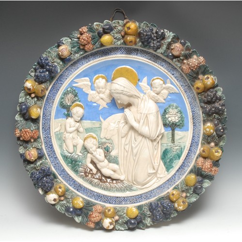 3361 - An Italian maiolica roundel, after Luca Della Robbia, The Madonna Del Presepio, 58cm diam