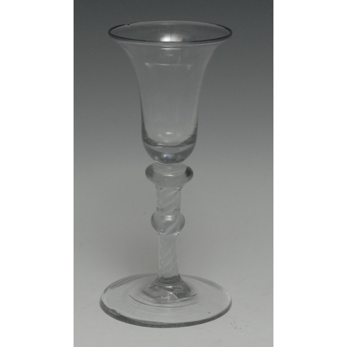 3343 - An early George III double opaque and cotton twist wineglass, trumpet-shaped bowl, the stem with gra... 