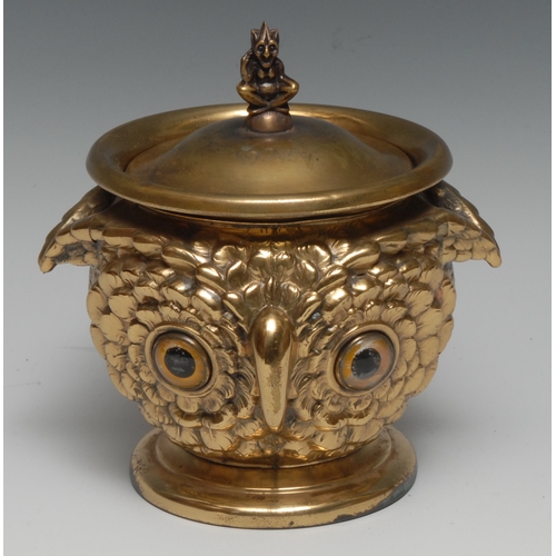 3317 - An early 20th century brass novelty tobacco jar, as an owl's head, double-sided, 16cm high