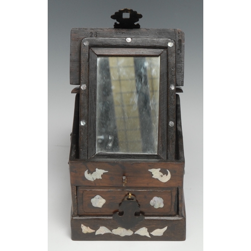 3100 - A Chinese hardwood and marquetry vanity box, hinged cover enclosing a folding mirror, above a drawer... 