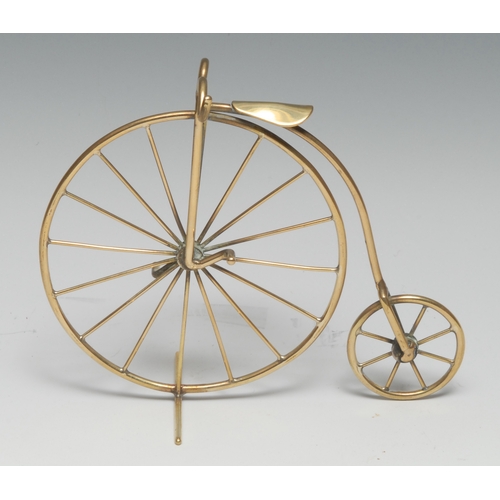 3397 - Cycling - a brass desk model, of a penny farthing or ordinary bicycle, 13cm high