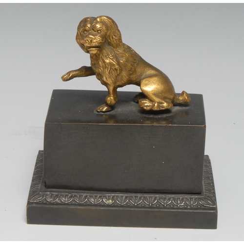 3025 - A 19th century dark patinated and gilt bronze encrier, the push-fitting cover surmounted by a dog, e... 