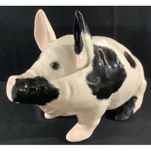 63 - A Griselda Hill Wemyss ware pottery pig, seated, black markings, 31cm high, painted marks