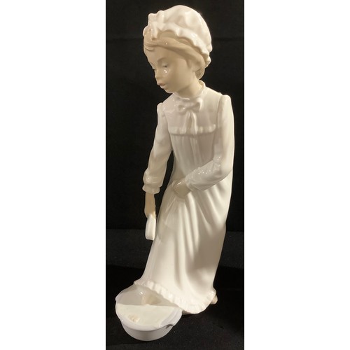 64 - A Nao by Lladro figure, bedtime foot bath, 29cm high