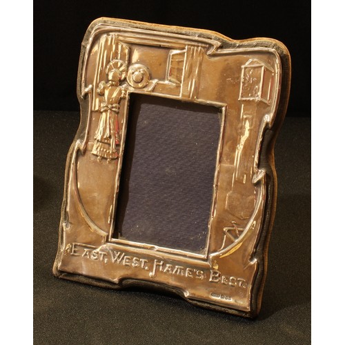 97 - An Elizabeth II silver novelty easel photograph frame, East West, Home's Best, 15.5cm high, London 1... 