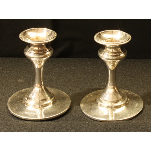 98 - A pair of Art Nouveau silver candlesticks, 10.5cm high, Henry Clifford Davis, Birmingham 1908