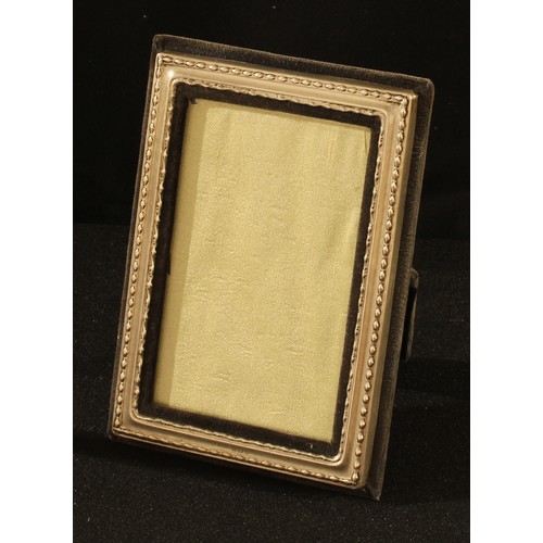 99 - An Elizabeth II silver rectangular easel photograph frame, Birmingham 1981