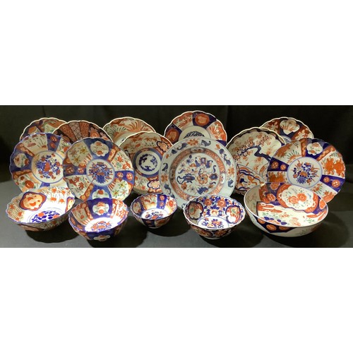 160 - An 18th century Chinese plate, c.1770, 23cm diameter; a set of three Japanese Imari plates, central ... 