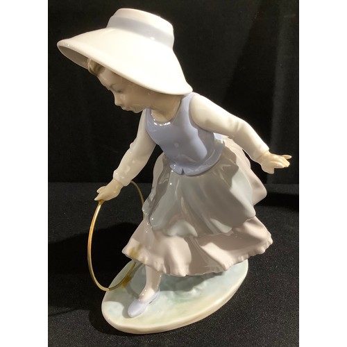 178 - A Nao by Lladro figure, young girl with hoop, 20cm high