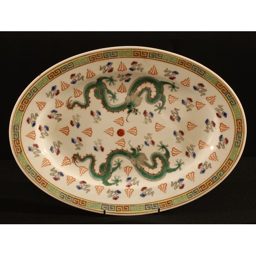 180 - A Chinese oval dragon dish, 35cm long