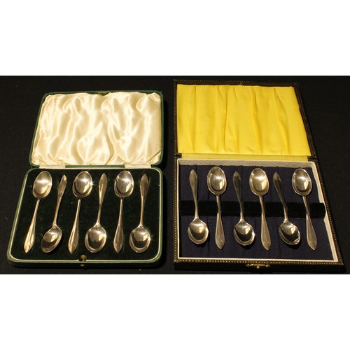 181 - A set of six silver teaspoons, Sheffield 1944, cased; another set similar, Sheffield 1937, cased, ap... 