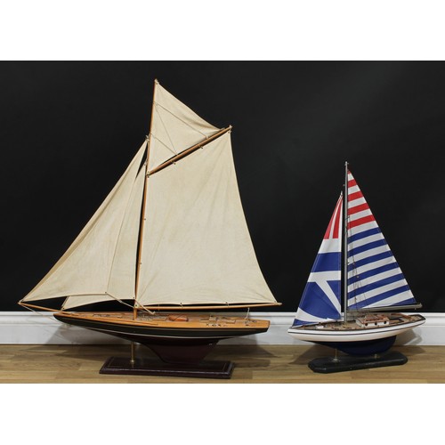 200 - Model Sailing - a wooden model of a sailing yacht, 100cm over base; another, smaller, 71cm over base... 