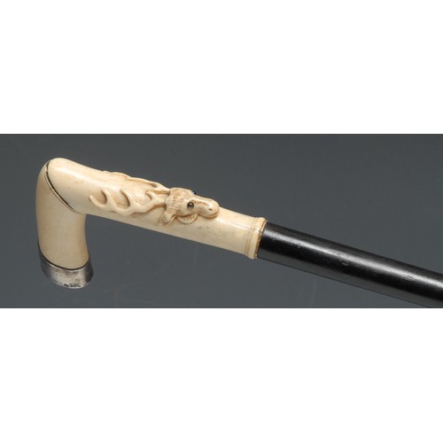 3339 - An early 20th century silver coloured metal gentleman's walking stick, the ivory L-shaped handle car... 