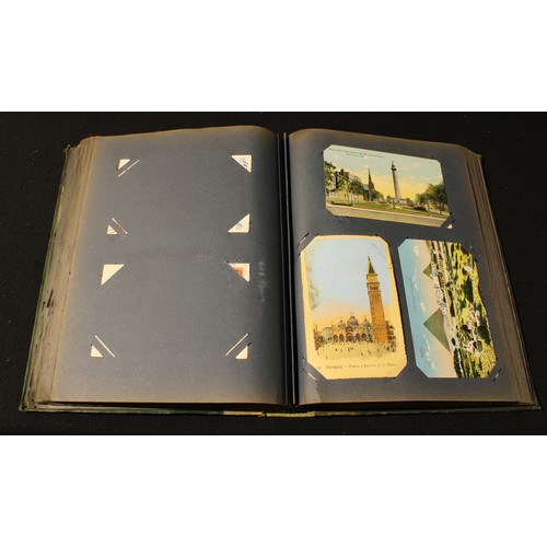 297 - An Edwardian postcard album containing British and world postcards, early to late 20th century