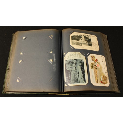 297 - An Edwardian postcard album containing British and world postcards, early to late 20th century