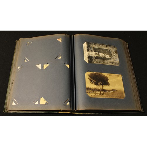 297 - An Edwardian postcard album containing British and world postcards, early to late 20th century