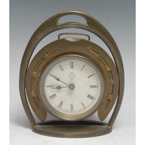 3316 - An early 20th century brass novelty equestrian desk timepiece, as a horseshoe within a stirrup, 7cm ... 