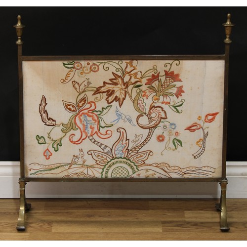 358 - An embossed brass fender, 128cm wide; a Regency style brass and tapestry fire screen, spire finials,... 