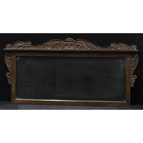 430 - An oak framed over mantel mirror, carved with central zephyr mask and scrolls, 92cm x 47cm; other si... 