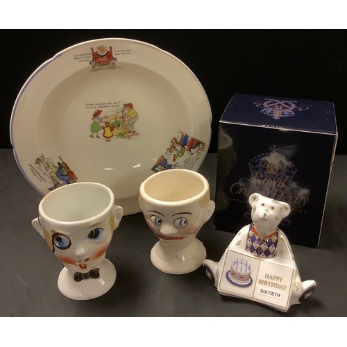 509 - A Royal Crown Derby paperweight, Happy Birthday bear;  novelty eggcups;  Grindley nursery bowl (4)