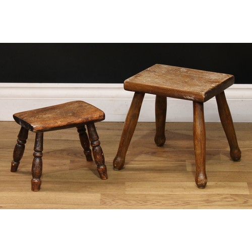 515 - An early 20th century elm milking stool, 18cm high;  another, elm and beech, 26cm high (2)