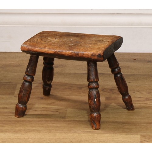 515 - An early 20th century elm milking stool, 18cm high;  another, elm and beech, 26cm high (2)